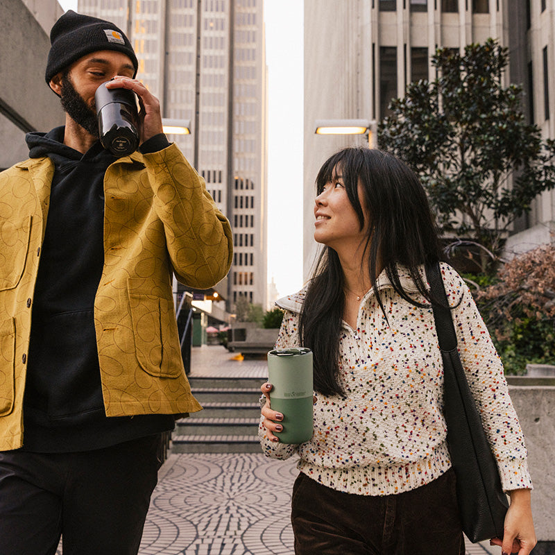 16oz-rise-tumbler-x8 16oz_rise_tumbler_black_iceberg_couple_drink_city_street_square.jpg