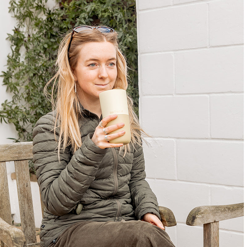 16oz-rise-tumbler-x8 16oz_rise_tumbler_wax_yellow_woman_seat_outside_square.jpg