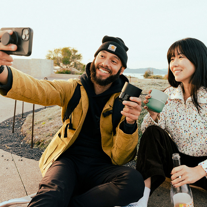 bring-your-own-party-kit-tumblers-and-cocktails-v6 8oz_rise_lowball_black_iceberg_couple_selfie_city_square.jpg
